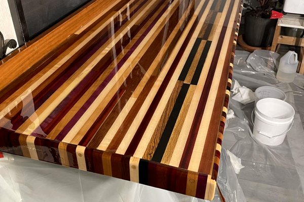 An in-progress epoxy countertop project featuring a wooden countertop substrate with a coating of UltraClear Bar & Table Top Epoxy.