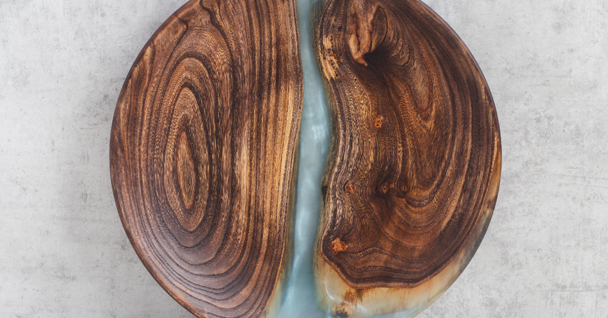 A small, circular wooden epoxy river table