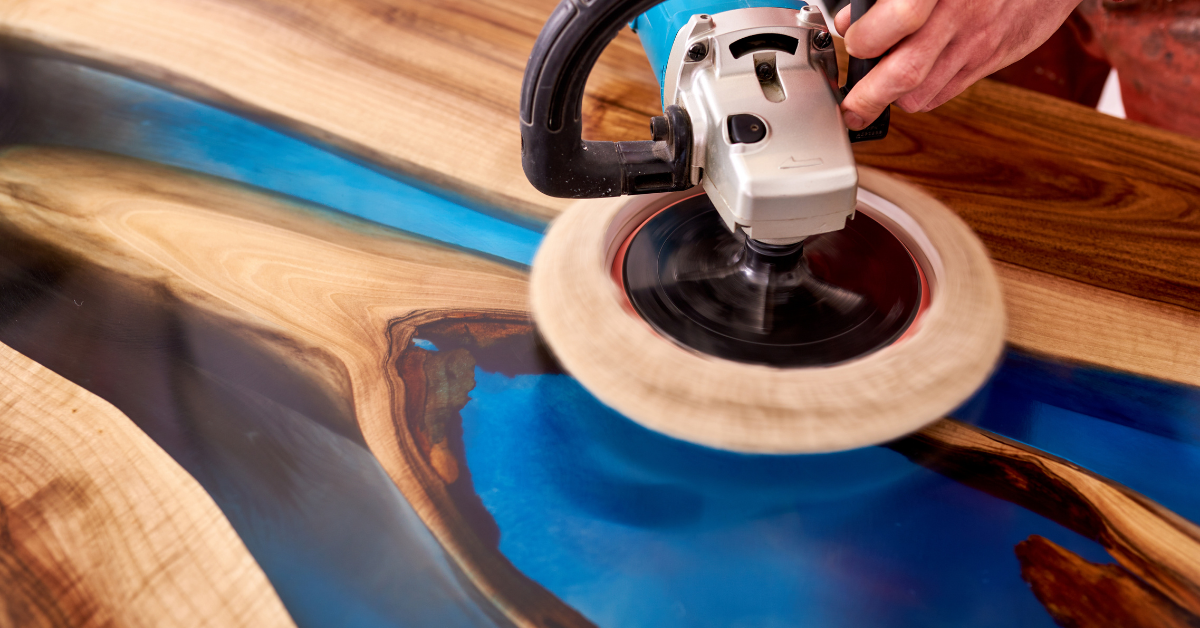 An epoxy river table being buffed