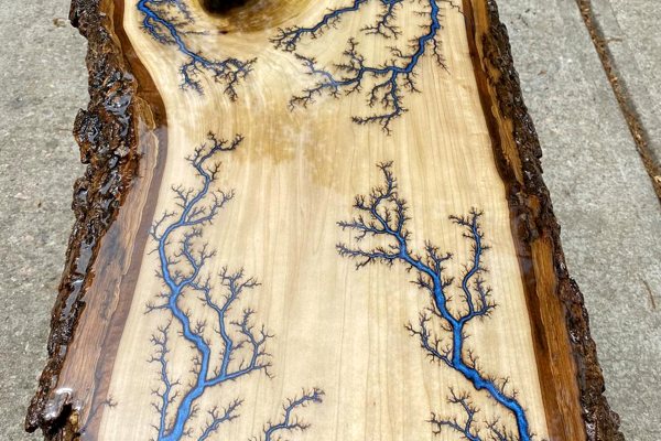 A live-edge wooden coffee table with an epoxy finish.