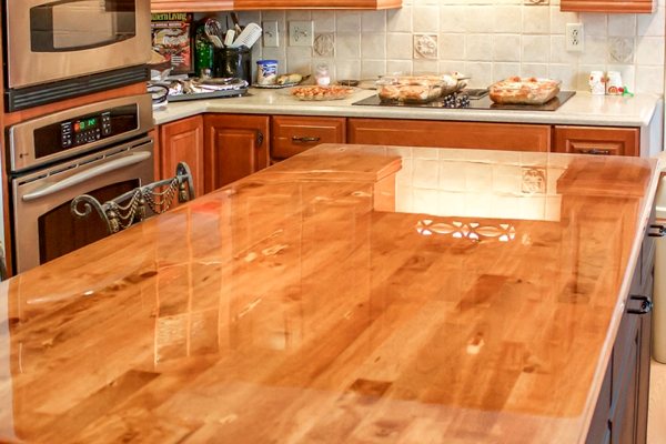 A kitchen island countertop with a perfectly smooth UltraClear Bar & Table Top Epoxy finish.