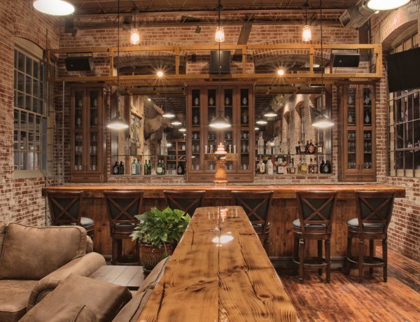 A bar room with several countertops and tables coated with epoxy resin.