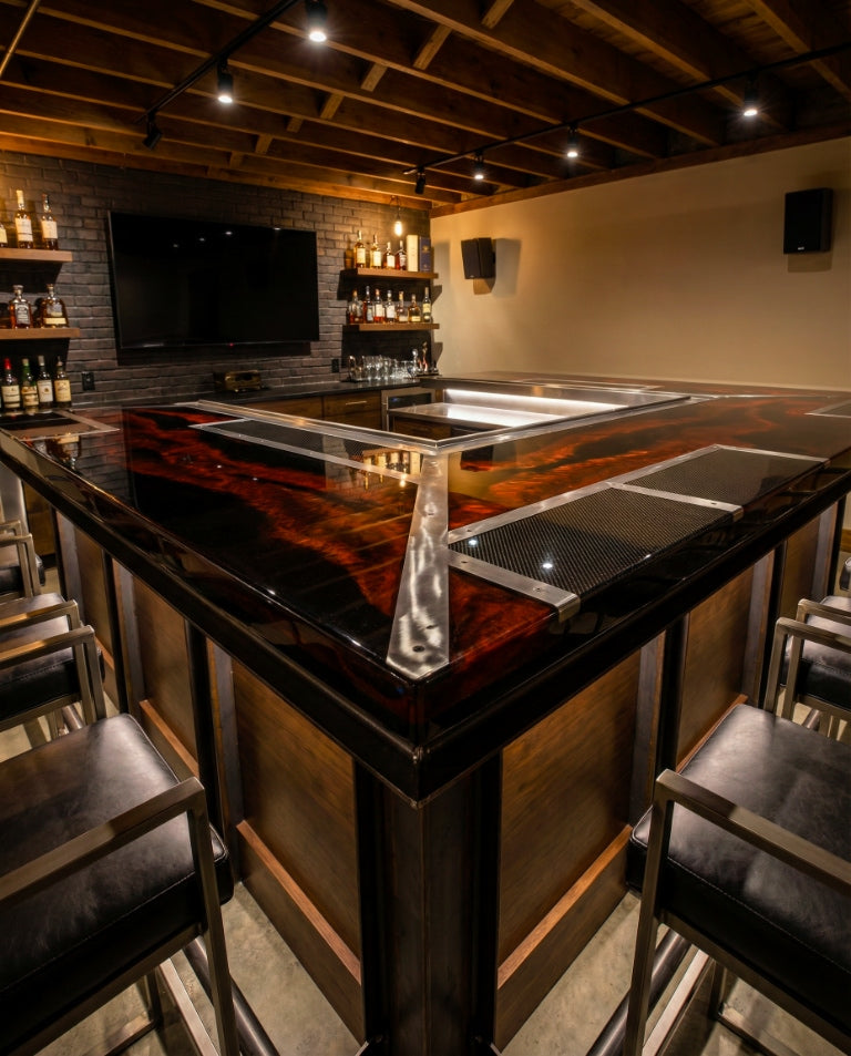 Industrial man cave bar with a glossy black epoxy top, ember-red marbling, steel inlays, and warm lighting beneath exposed wood ceiling beams.