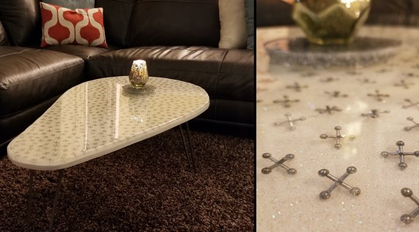 An epoxy coffee table top with embedded jacks for a fun, creative aesthetic. It was made using UltraClear Bar & Table Top Epoxy.