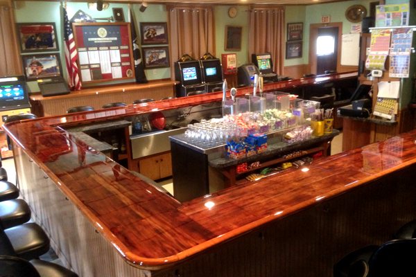 A large commercial epoxy bar top with a wooden substrate and an UltraClear Bar & Table Top Epoxy finish.