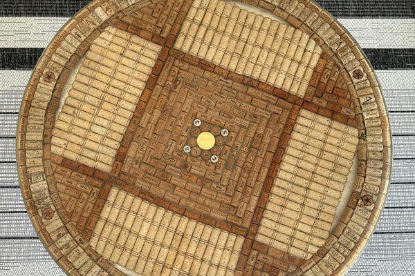 An overhead view of an epoxy coffee table with an embedded layer of carefully arranged bottle corks. It was made using UltraClear Bar & Table Top Epoxy.