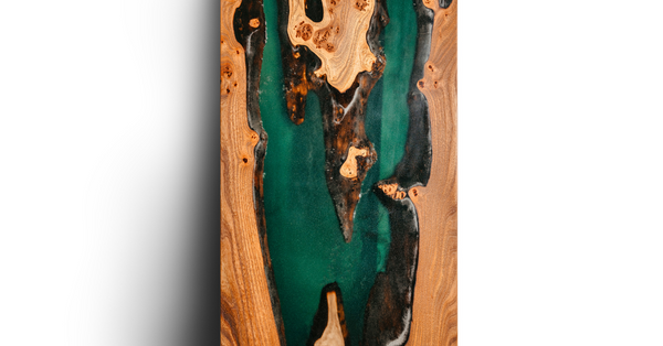 A thin sample slab of wood featuring a green-pigmented epoxy vein