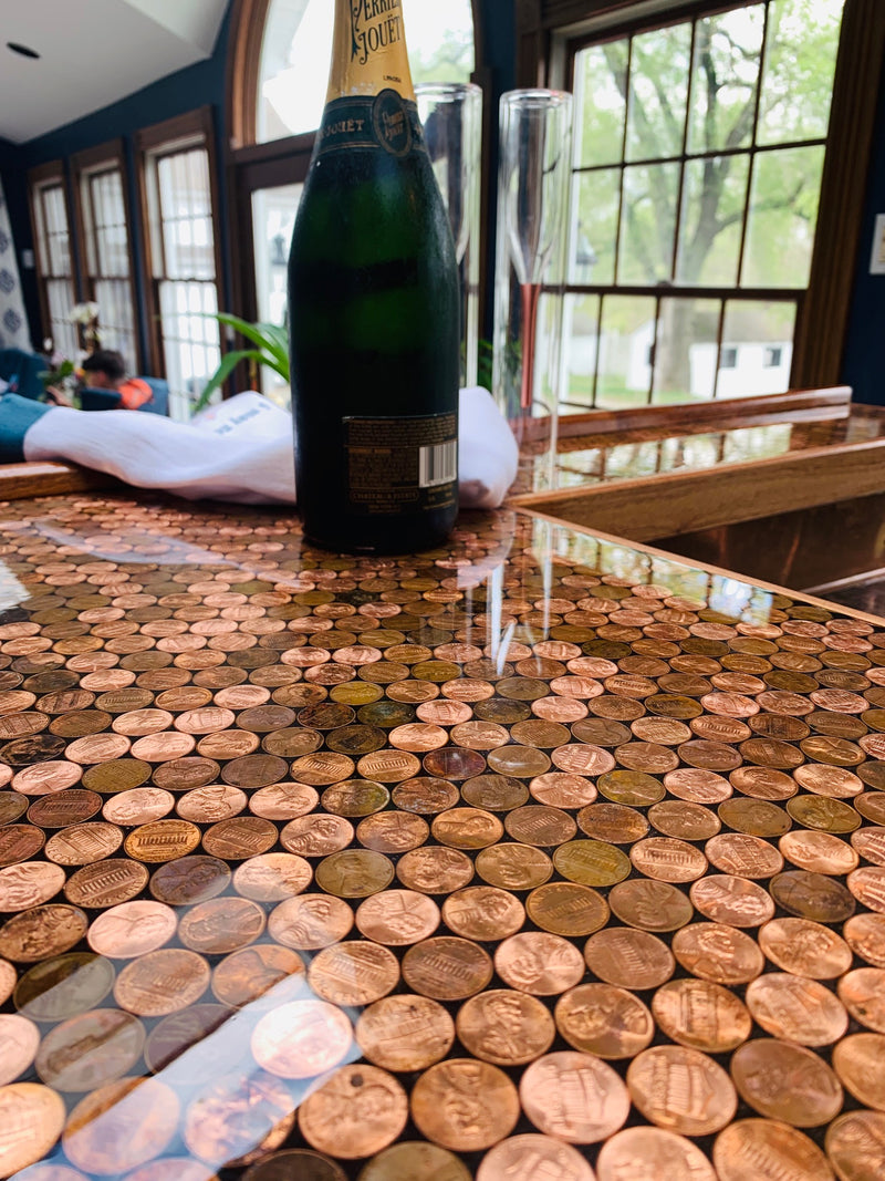 An epoxy penny bar top, shown up close