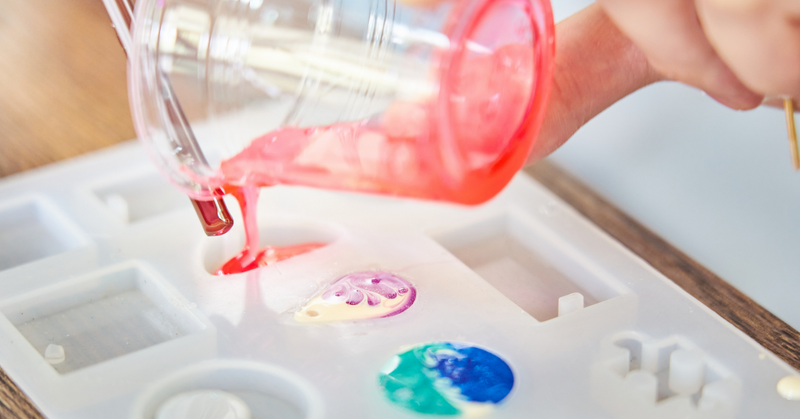 Pigmented epoxy resin being poured into a mold