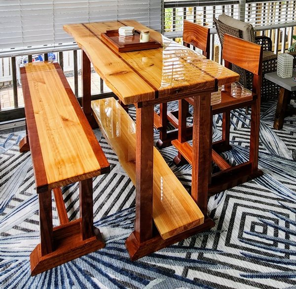 A restaurant table top and accompanying seating with an epoxy finish.