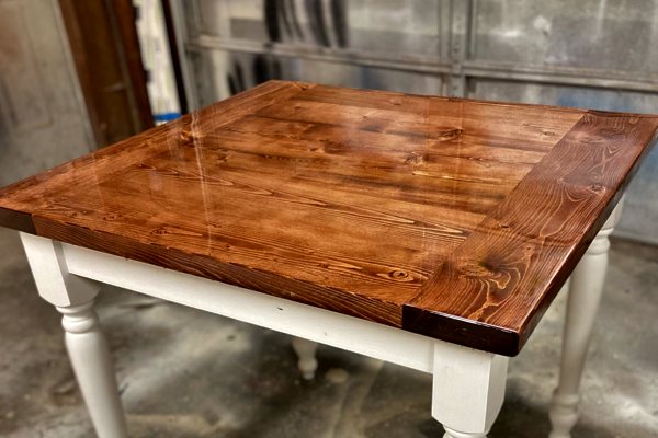 A square-shaped wooden epoxy table top with a pristine coating of UltraClear Bar & Table Top Epoxy.
