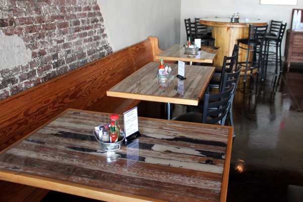 A restaurant eating room. Three tables can be seen, each with an UltraClear Bar & Table Top Epoxy finish, which is commercial-grade for high-traffic environments like this.