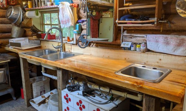 An epoxy countertop in a wooden cabin kitchen.