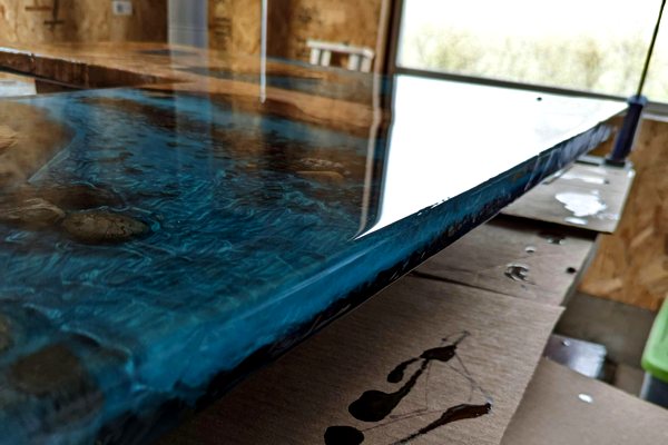 A deep pour epoxy bar top with a thick, layered epoxy finish.