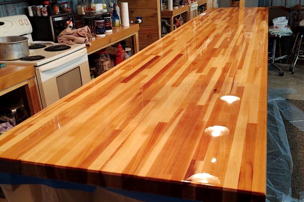 An epoxy kitchen countertop with a beautiful UltraClear Bar & Table Top Epoxy finish over a wooden substrate.