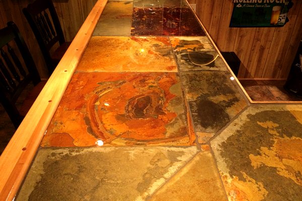 A DIY epoxy bar top with a stone tile substrate