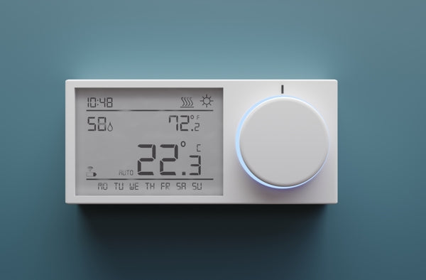 A thermostat showing the current humidity level and temperature of the room it's in.