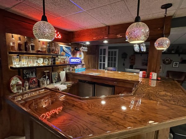 A wooden epoxy resin bar top with a clear coating of epoxy resin.