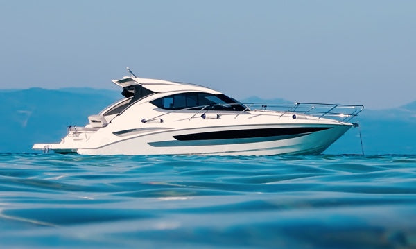 An epoxy-coated motor boat out on the water