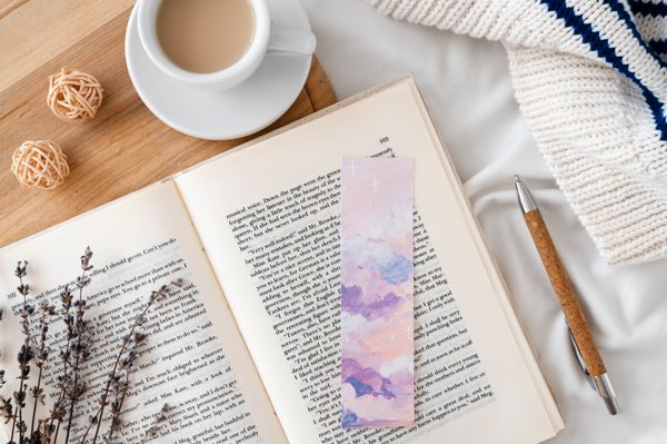 An epoxy resin bookmark resting on an open book.