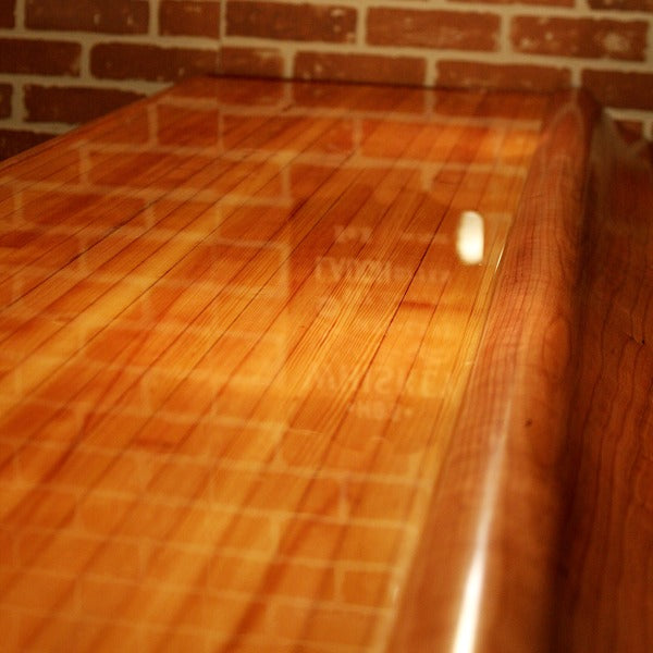 A closeup of a bar top with an epoxy finish.