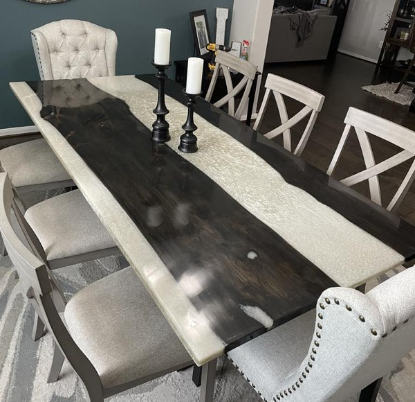 A beautiful indoor wooden epoxy river table.