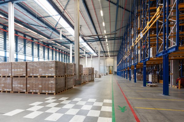 A warehouse with numerous boxes containing unshipped epoxy.