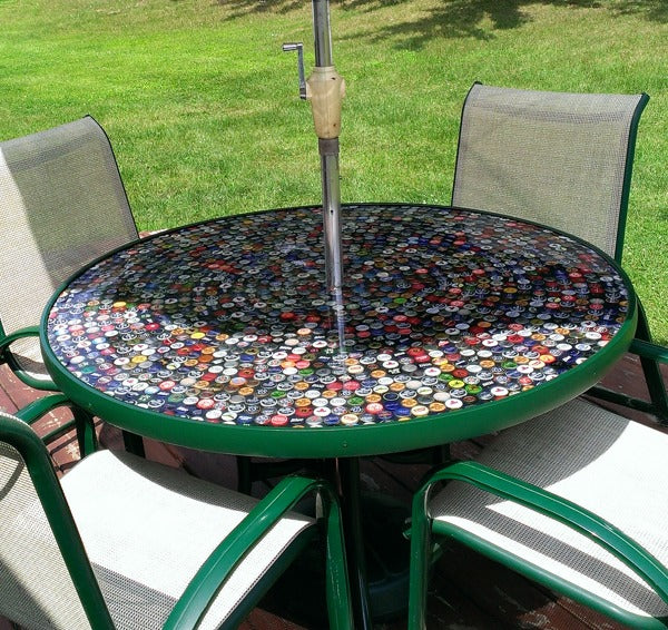 An outdoor bottlecap epoxy table top made using UltraClear Bar & Table Top Epoxy.