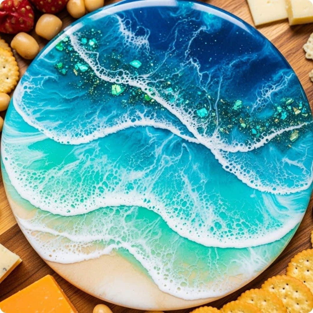Decorative cheese board with ocean wave design on a wooden surface with snacks.