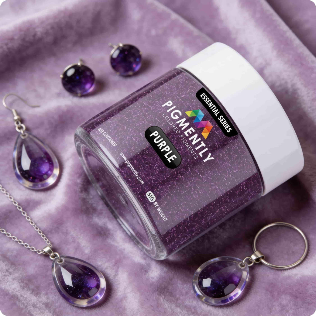 Purple glitter powder pigment with jewelry on a purple fabric background
