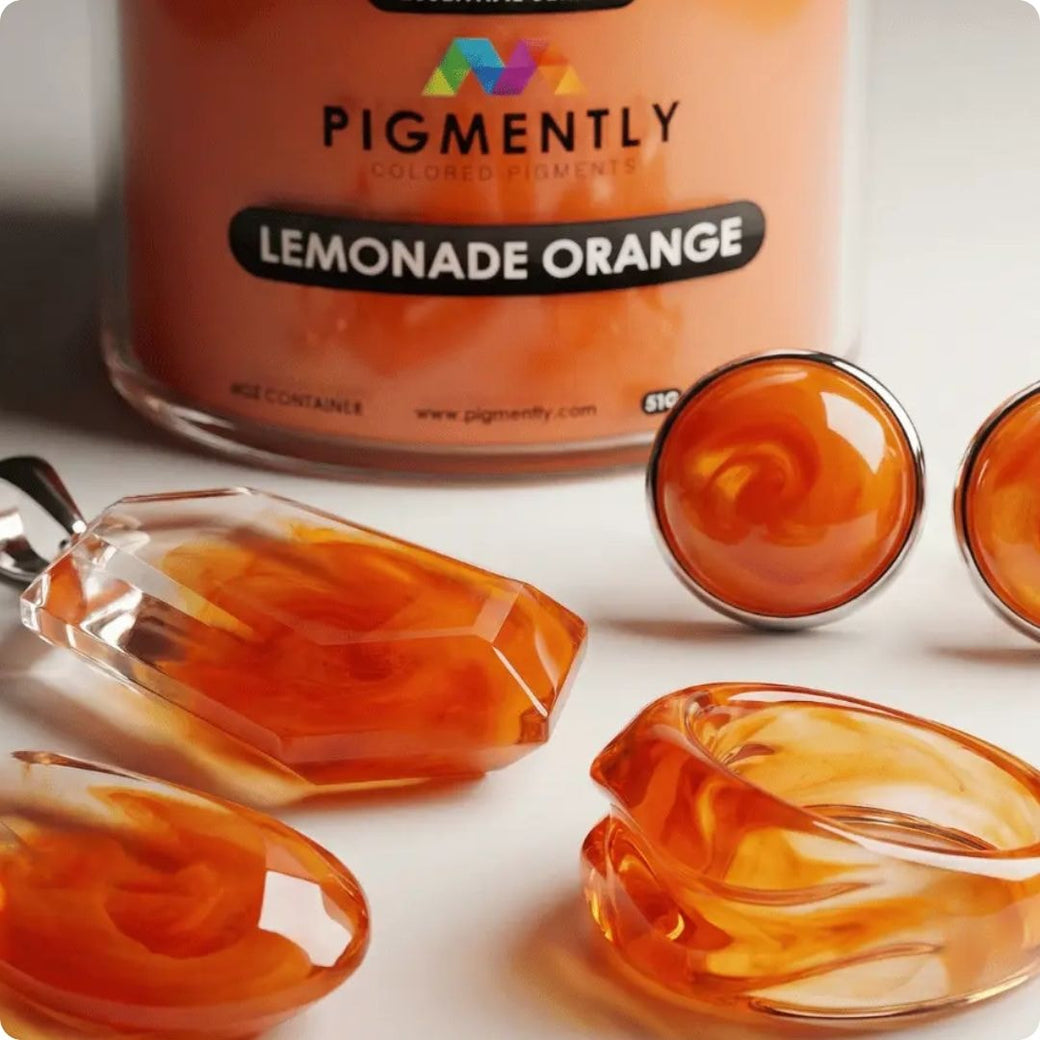 powder pigment labeled 'Lemonade Orange' with orange-colored objects on a white background