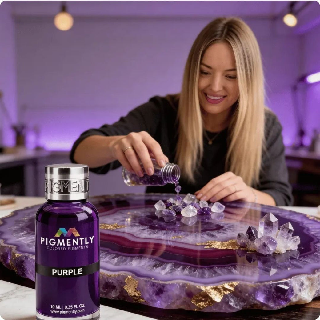Ilona pouring purple pigment into crystals on a decorative plate with a bottle of Purple pigment.