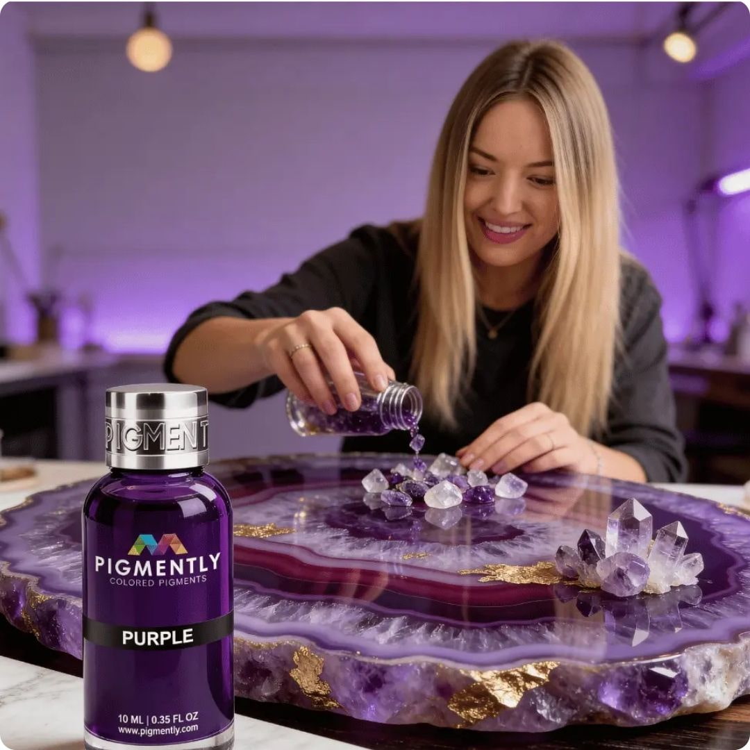 Ilona pouring purple pigment into crystals on a decorative plate with a bottle of Purple pigment.