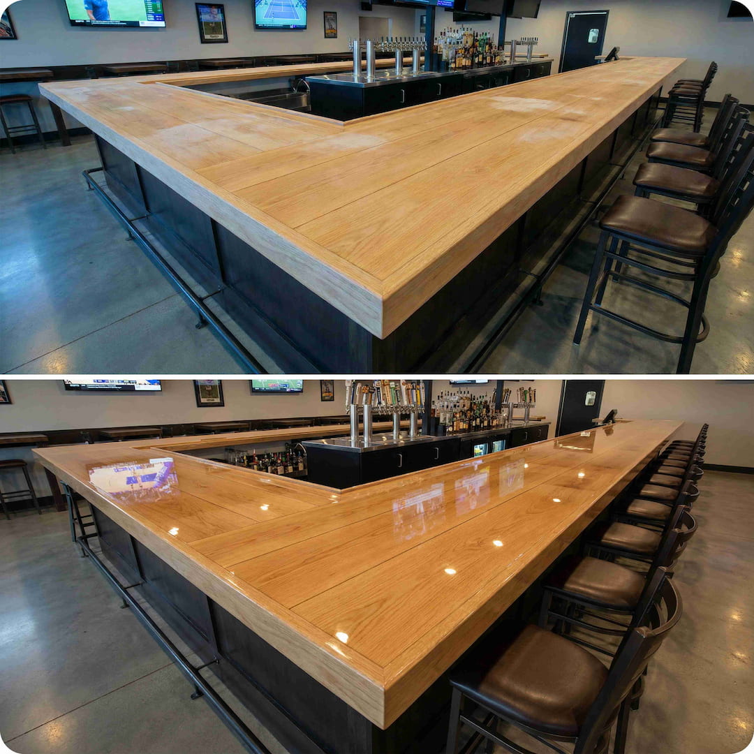 Long wooden bar table with stools in a bar setting